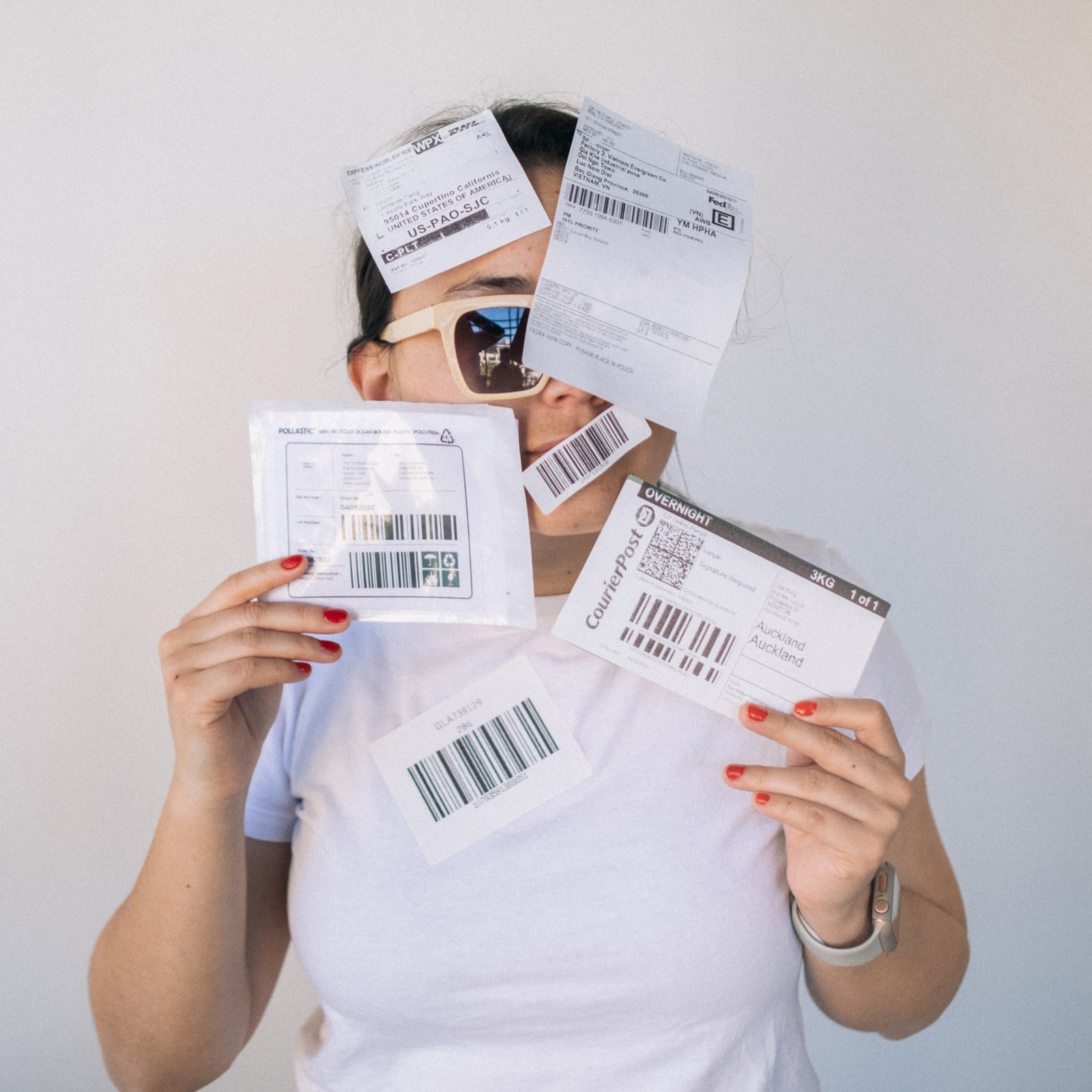 A mixture of compostable and POLLAST!C labels range stuck on a person